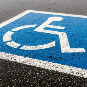 Young woman using wheelchair and reading – education accessibility.
